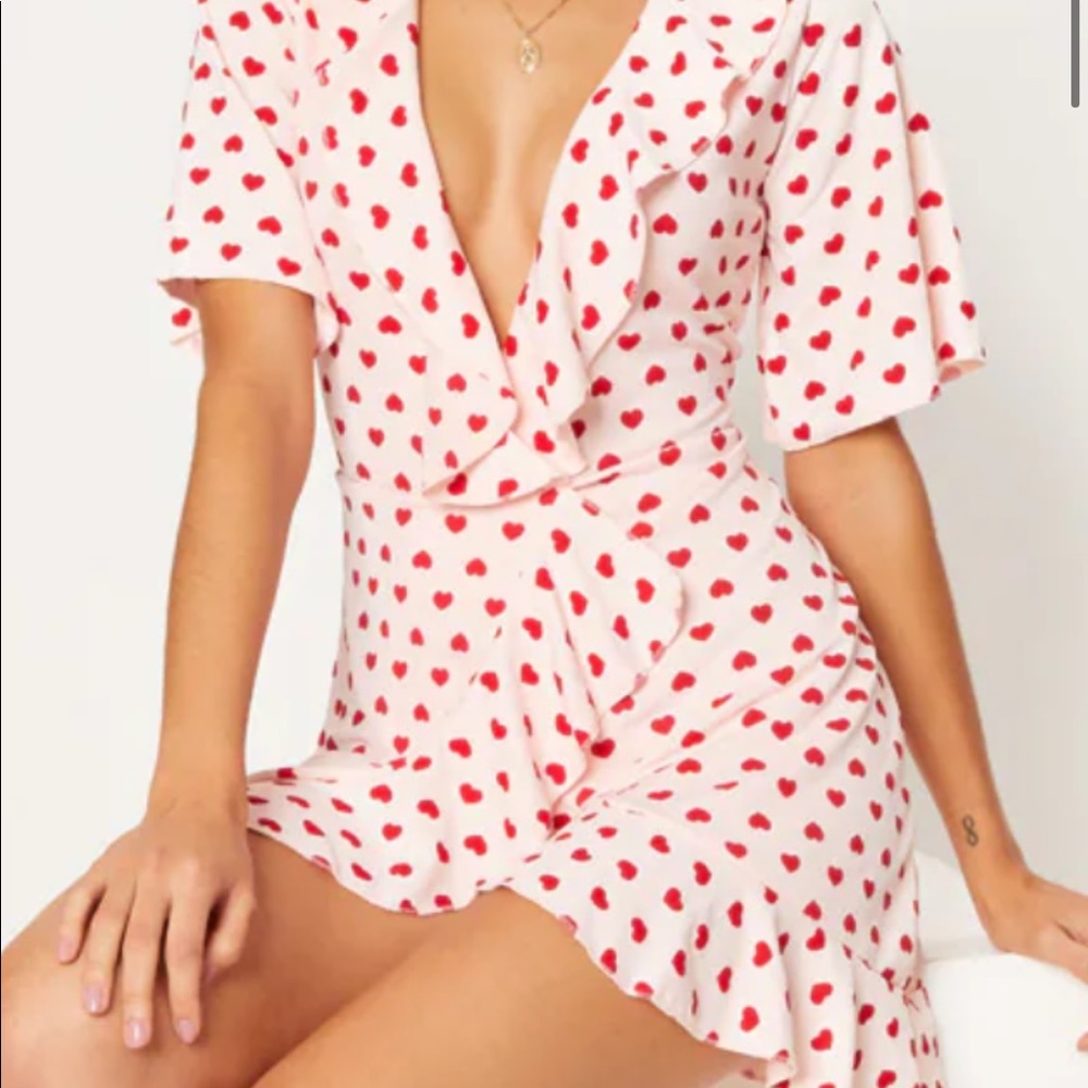 Pink Heart Print Frill Wrap. Light pink with red hearts